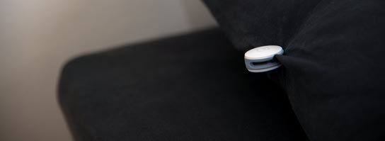 Pill motion tracker attached to a pillow, part of the Sense seep system